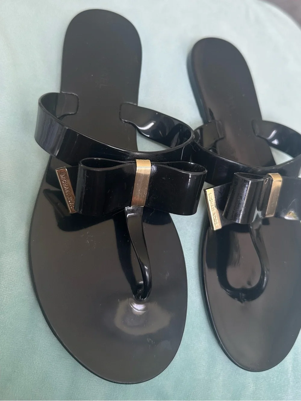 Michael Kors Black Jelly Bow Thong Sandals with Gold Accents